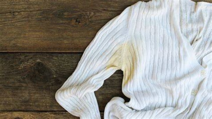 What causes brown sweat stains on sheets?